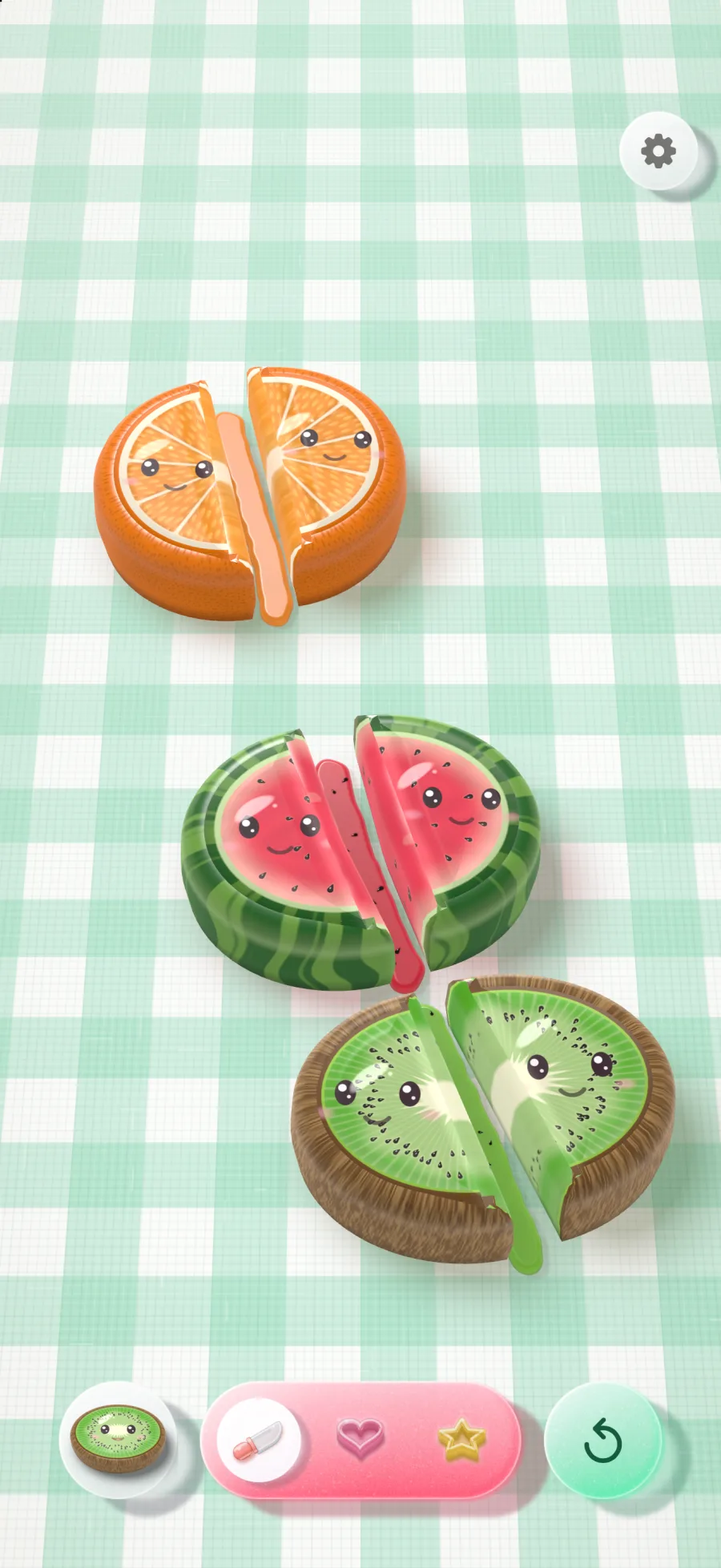 A jelly orange, watermelon and kiwi on a picnic-cloth board, each cut in two, every half smiling